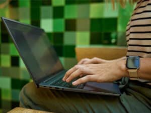 Close up of woman typing on laptop